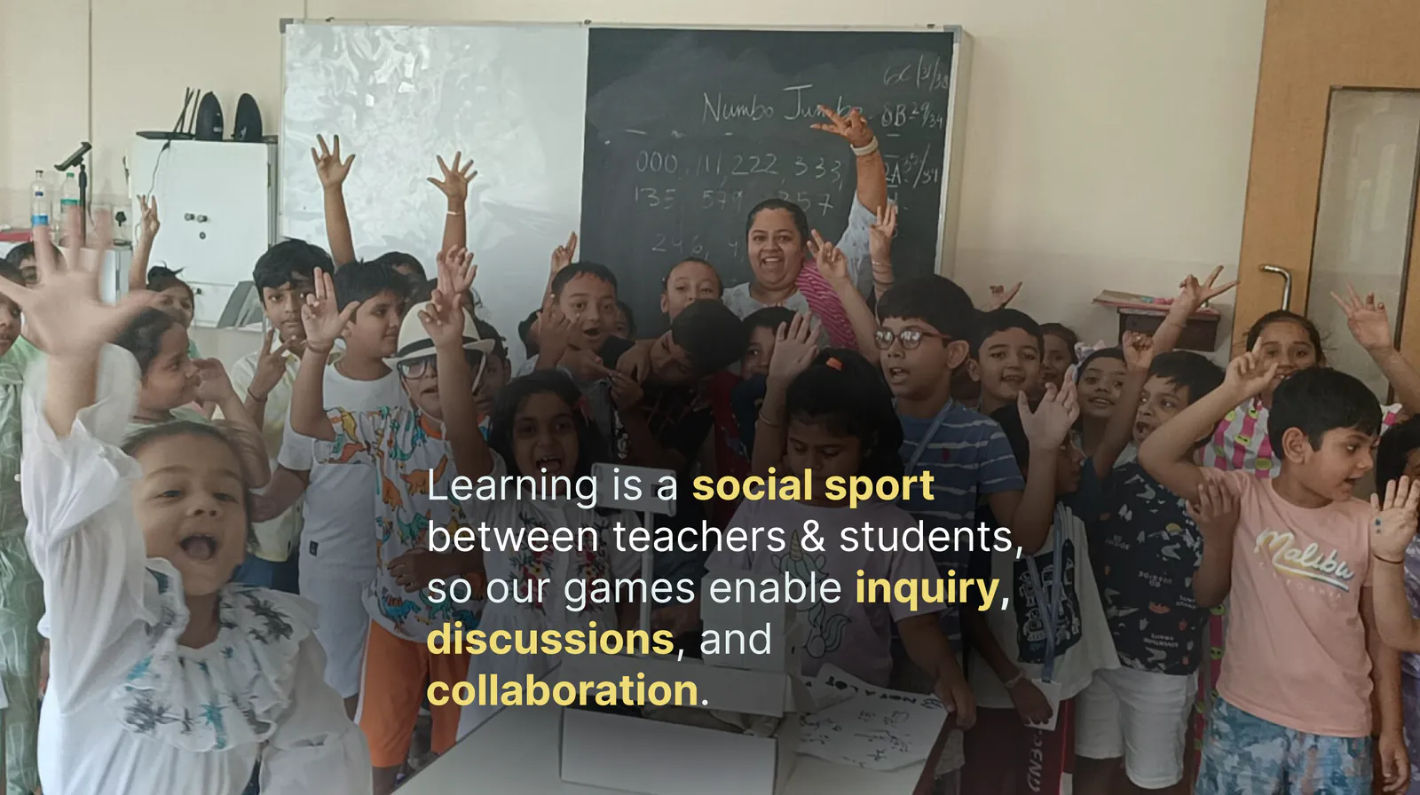 Learning is a social sport between teachers & students, so our games enable inquiry, discussions, and collaboration. A cheering class with their teacher.